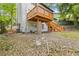 Backyard view of a two-story home featuring a wooden deck and staircase at 2599 Willow Creek Dr, Duluth, GA 30096