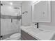 Modern bathroom featuring glass enclosed shower, neutral color scheme, updated vanity and sleek fixtures at 2599 Willow Creek Dr, Duluth, GA 30096