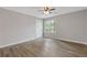 Well-lit bedroom with hardwood flooring and a ceiling fan at 2599 Willow Creek Dr, Duluth, GA 30096