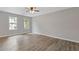 Spacious bedroom with hardwood flooring and two large windows at 2599 Willow Creek Dr, Duluth, GA 30096