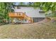 Back of house elevation showing yard, deck, and natural surroundings at 2599 Willow Creek Dr, Duluth, GA 30096