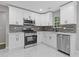 Stylish kitchen with white cabinetry, stainless steel appliances, and sleek countertops at 2599 Willow Creek Dr, Duluth, GA 30096