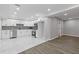 Renovated kitchen boasting sleek white cabinets, stainless steel appliances, and elegant marble floors at 2599 Willow Creek Dr, Duluth, GA 30096