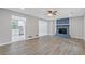 Spacious living room with stone fireplace, sleek flooring, and ample natural light at 2599 Willow Creek Dr, Duluth, GA 30096
