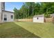 The fenced backyard has a well-maintained lawn and a shed at 272 Broadstone Blvd, Acworth, GA 30101