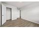 This bedroom features wood-look flooring and closet with an open door at 272 Broadstone Blvd, Acworth, GA 30101