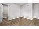 Bright bedroom featuring hardwood floors, neutral paint, and a walk-in closet in the corner at 272 Broadstone Blvd, Acworth, GA 30101