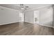 Spacious bedroom featuring an ensuite bathroom, crown molding, neutral paint, and hardwood floors at 272 Broadstone Blvd, Acworth, GA 30101