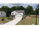 Charming two-story home features a well-manicured lawn and attached garage, perfect for Gathering living at 272 Broadstone Blvd, Acworth, GA 30101
