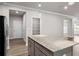 Kitchen island boasts granite countertops and ample storage space at 272 Broadstone Blvd, Acworth, GA 30101
