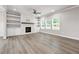 Spacious living room features a fireplace, hardwood floors, and built-in shelves at 272 Broadstone Blvd, Acworth, GA 30101