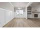 Living room features a fireplace, hardwood floors, and wainscotting at 272 Broadstone Blvd, Acworth, GA 30101