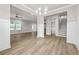 Open-concept living room with hardwood floors and plenty of natural light at 272 Broadstone Blvd, Acworth, GA 30101