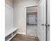 Mudroom featuring a built-in bench with storage and access to garage at 272 Broadstone Blvd, Acworth, GA 30101