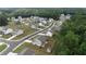 Aerial view of a residential neighborhood featuring well-maintained homes and lush greenery at 272 Broadstone Blvd, Acworth, GA 30101