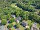 Aerial view of a home near a golf course and neighborhood pool at 414 Dogwood Way, Canton, GA 30114