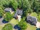 Beautiful aerial view of a home with mature trees and landscaped grounds at 414 Dogwood Way, Canton, GA 30114