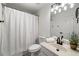 Cozy bathroom featuring a shower-tub combo and tiled floor at 414 Dogwood Way, Canton, GA 30114