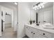 Bright bathroom with double vanity and doorway to an additional room at 414 Dogwood Way, Canton, GA 30114