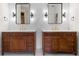 Elegant bathroom featuring dual vanities, modern fixtures, and sleek mirrors at 414 Dogwood Way, Canton, GA 30114