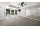 A bright bedroom with carpet, large windows, and a spacious interior featuring a ceiling fan at 414 Dogwood Way, Canton, GA 30114