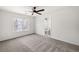Bright bedroom with neutral carpet, ceiling fan, and an ensuite bathroom at 414 Dogwood Way, Canton, GA 30114
