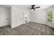 Bedroom featuring neutral carpeting, a ceiling fan, and two closets at 414 Dogwood Way, Canton, GA 30114