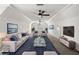Open-concept bonus room with plush carpeting, couches, tables, and tv at 414 Dogwood Way, Canton, GA 30114