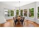 Charming breakfast nook with natural light, hardwood floors, and views of the backyard at 414 Dogwood Way, Canton, GA 30114