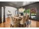 Elegant dining room features hardwood floors, decorative columns and a chandelier at 414 Dogwood Way, Canton, GA 30114