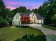 Stunning two-story home with lush landscaping, a circular drive, and a beautifully maintained lawn at 414 Dogwood Way, Canton, GA 30114