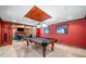 A recreation room with a pool table, seating, and a view of the fireplace at 414 Dogwood Way, Canton, GA 30114