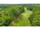 Scenic view of the golf course with lush green fairways surrounded by mature trees at 414 Dogwood Way, Canton, GA 30114