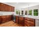 Gourmet kitchen area boasting a breakfast nook, stainless steel appliances, hardwood floors and many windows at 414 Dogwood Way, Canton, GA 30114