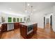 Spacious kitchen featuring a large island, stainless steel appliances, and hardwood floors at 414 Dogwood Way, Canton, GA 30114