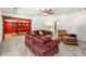 Cozy living room with plush seating, neutral tones, carpeted floors, and views into the game room at 414 Dogwood Way, Canton, GA 30114