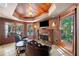 Elegant living room with a cozy fireplace and beautiful wood detailing with backyard view at 414 Dogwood Way, Canton, GA 30114