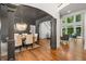 Bright, open living room with hardwood floors, soaring ceilings, and large windows at 414 Dogwood Way, Canton, GA 30114