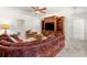 A comfortable living room with a large sofa, entertainment center, and soft carpet at 414 Dogwood Way, Canton, GA 30114
