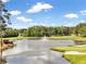 Scenic view of the pond with a fountain and the golf course in the background at 414 Dogwood Way, Canton, GA 30114