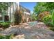 An outdoor pool area featuring a stone patio and lush landscaping perfect for relaxation at 414 Dogwood Way, Canton, GA 30114
