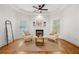 Sitting room showcasing a fireplace, hardwood floors, comfortable seating, and lots of natural light at 414 Dogwood Way, Canton, GA 30114
