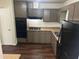 Efficient kitchen featuring sleek black appliances and tile floors at 6956 Kimberland Gardens Ln, Lithonia, GA 30058