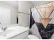 Bathroom with marble-look shower curtain, white cabinets, and single vanity at 1025 Cherryfield Run, Marietta, GA 30008