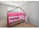 bedroom features a house frame bed with pink canopy and carpeted flooring at 1025 Cherryfield Run, Marietta, GA 30008
