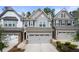 Charming townhomes featuring attached garages and well-maintained exteriors at 1025 Cherryfield Run, Marietta, GA 30008