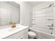 Bathroom featuring shower over tub, vanity, and flower accent at 1172 Edwin Ln, Sugar Hill, GA 30518