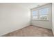 Bright bedroom with carpet, two windows and neutral walls at 1172 Edwin Ln, Sugar Hill, GA 30518