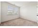 Bright bedroom with carpet, two windows and neutral walls at 1172 Edwin Ln, Sugar Hill, GA 30518