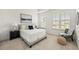 Serene main bedroom with natural light, neutral tones, and ample space at 1172 Edwin Ln, Sugar Hill, GA 30518